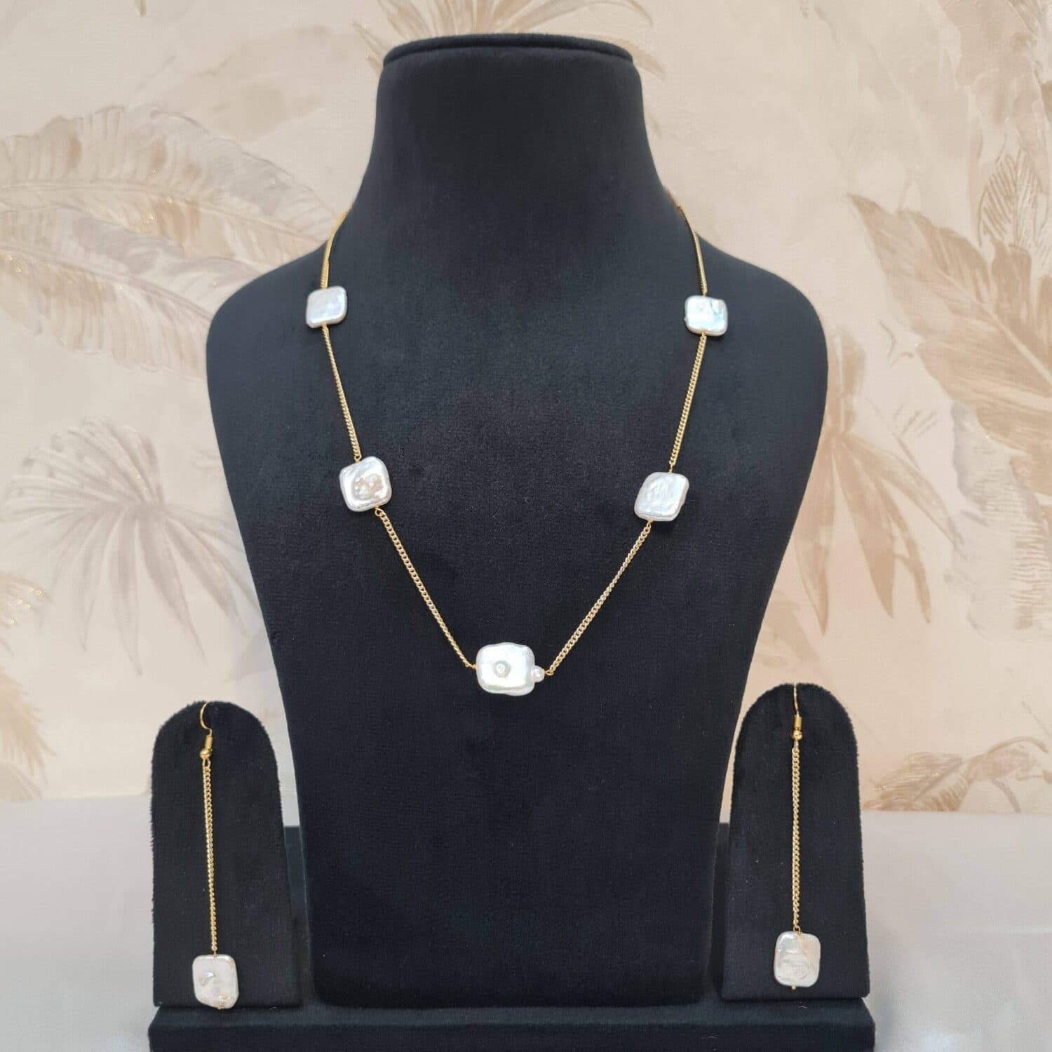 Coin in pearl jewellery from Pure Pearls