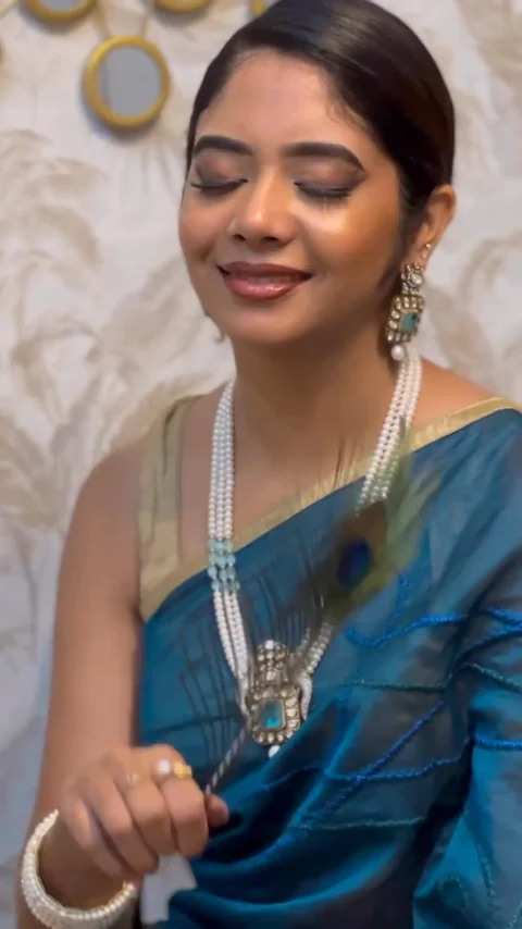 Three pearl necklace looks paired with blue, purple and yellow sarees.