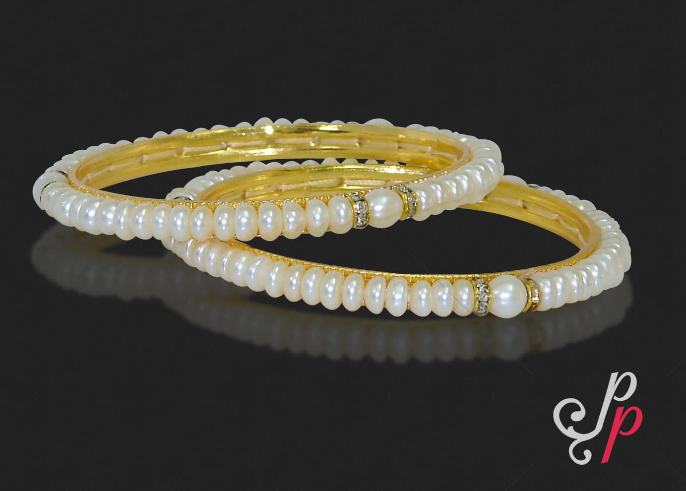 Pretty pearl bangle set with gold colour american diamond spacers