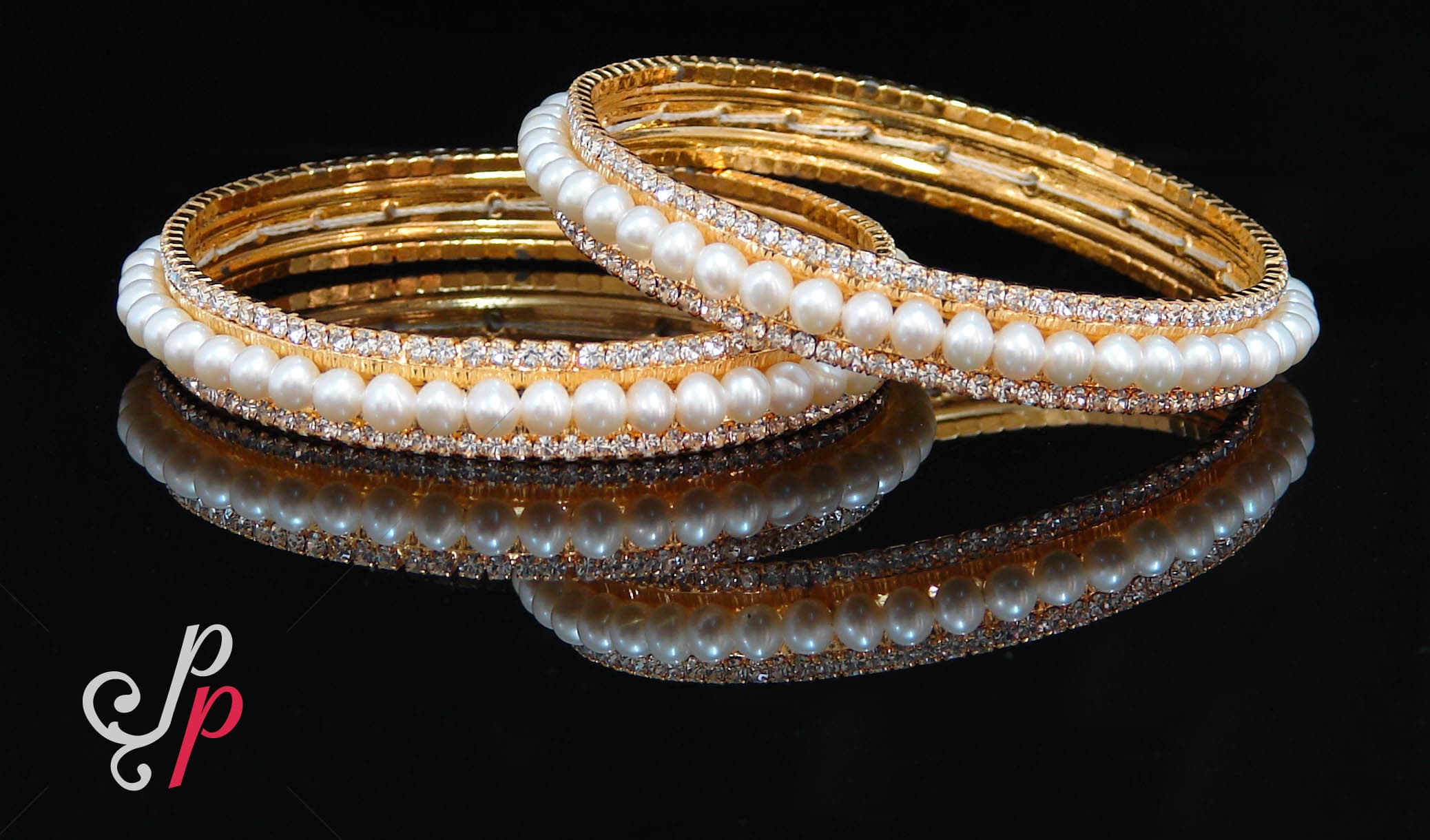 Pretty pearl bangles in AD studded golden frame