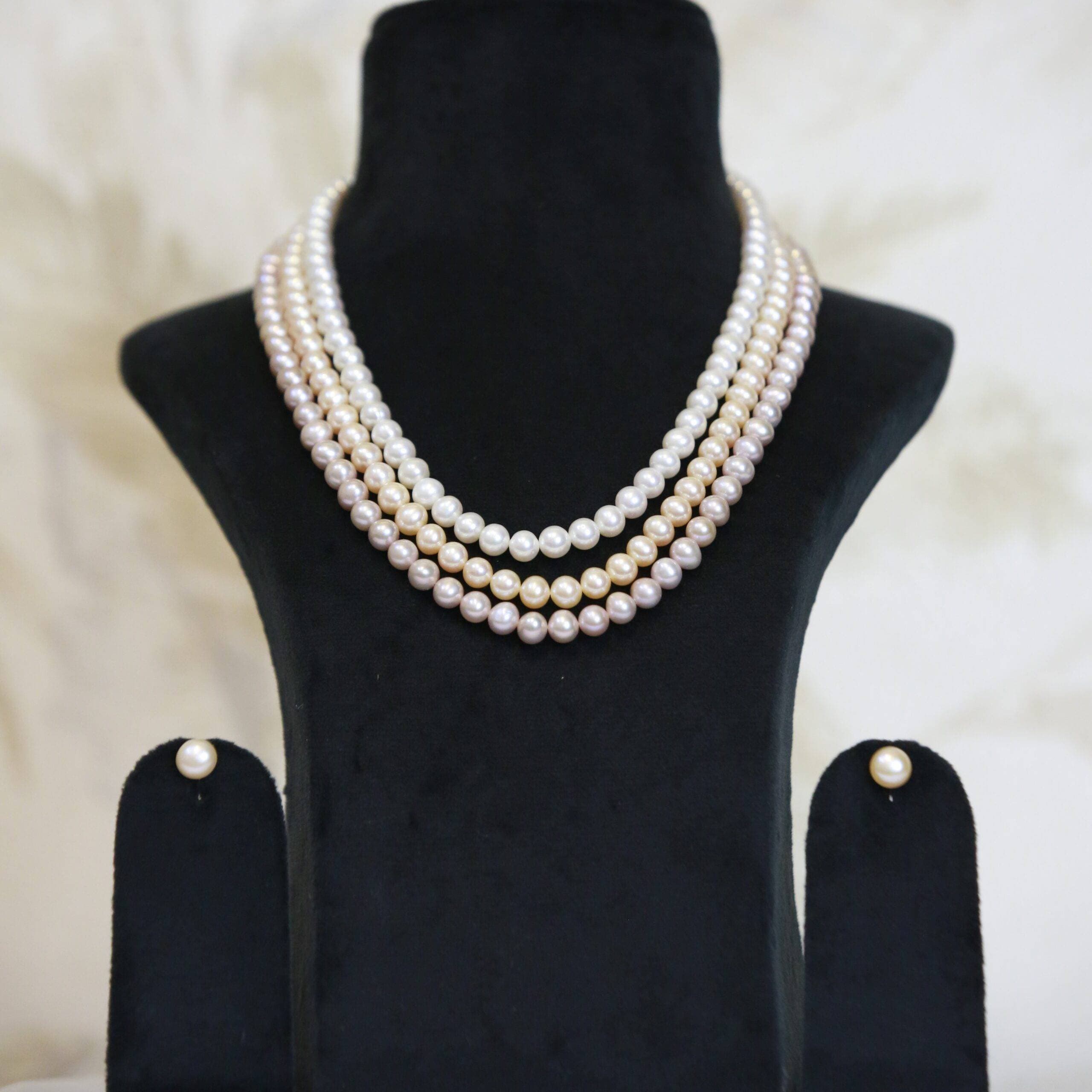 Brilliant Three Line 18Inch Pearl Necklace With White Peach & Pink Round Pearls
