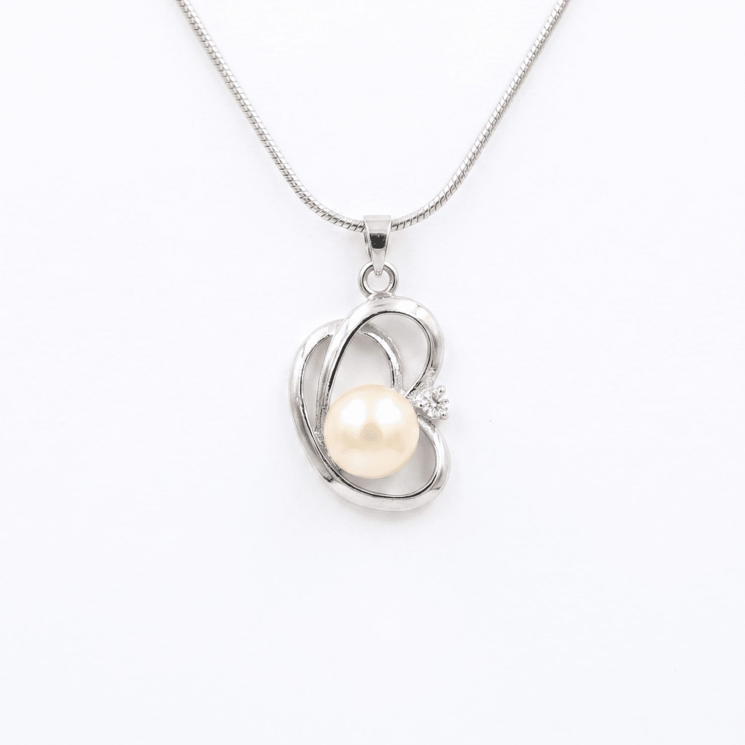 Elegant CZ Heart Pendant Accentuated With 10.5mm Peach Button Pearl