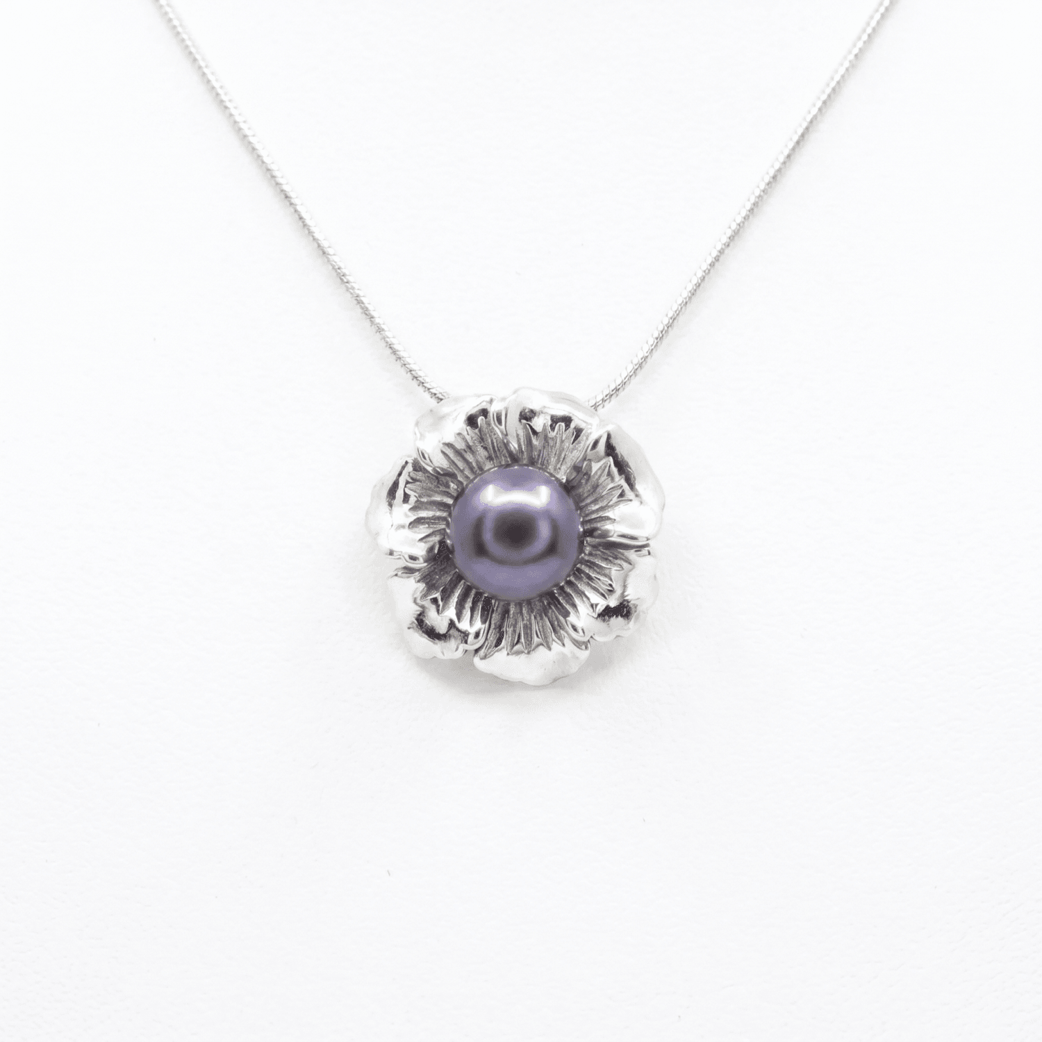Bold Silver Finish Floral Pendant With 12mm Blue Button Pearl