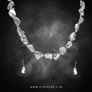 Stunning Silvery Freshwater Baroque Pearls photographed in smoke by Pure Pearls