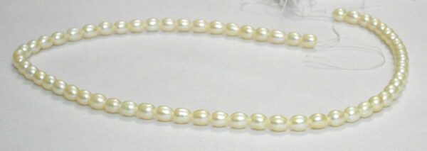 White oval medium pearl string