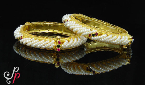Beautiful, elegant seed pearl bangles in red and green stones