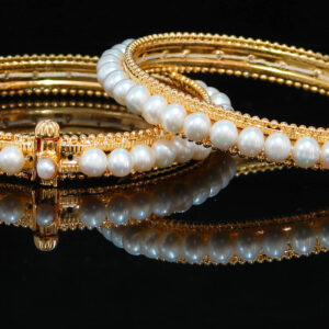 Beautiful pearl bangles in designer frame