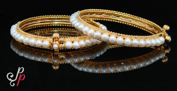 Beautiful pearl bangles in designer frame