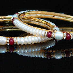 Pearl bangles in maroon colour stones