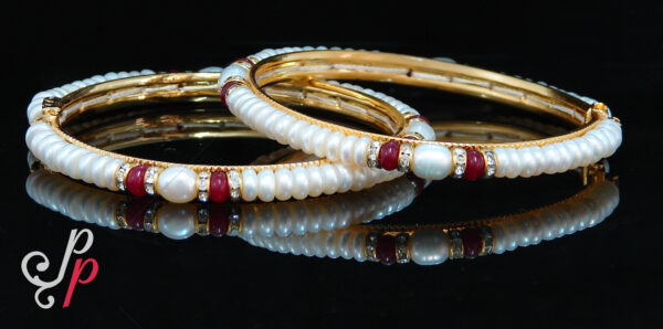 Pearl bangles in maroon colour stones