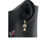 Pearl Jhumkas studded with American Diamonds