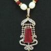 Pearl necklace set in temple styled zircon pendant