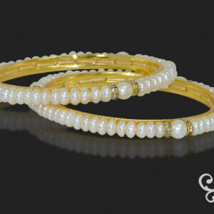 Pretty pearl bangle set with gold colour american diamond spacers