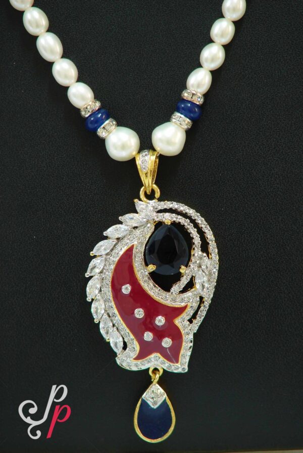 Pretty pearl necklace set in maroon meenakari and ink blue stone pendant