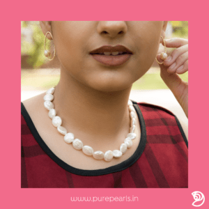 Indian woman wearing baroque pearl white necklace