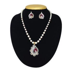 White oval pearls necklace with a simple pendant studded with a semiprecious ruby and zircon