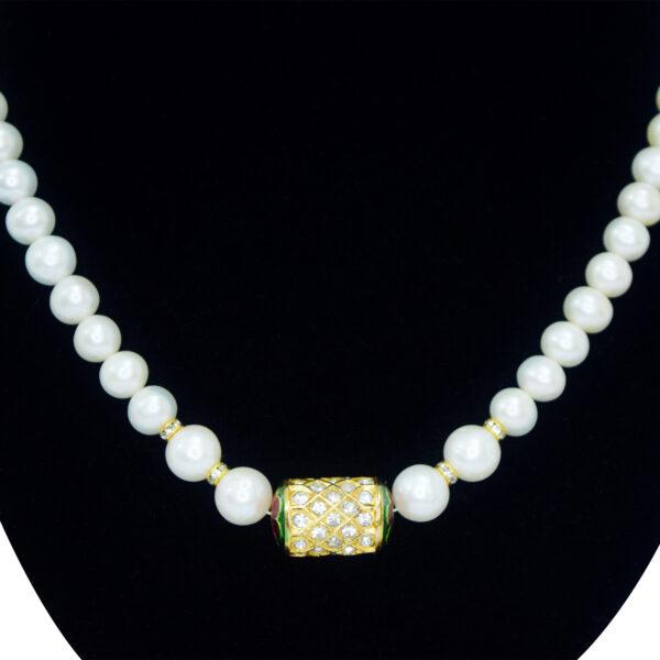 Well-crafted single-layer round white pearl necklace with jadau meenakari dholak bead pendant - close up