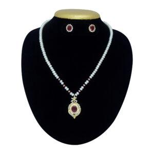 White pearls necklace featuring an ethnic pendant studded with American Diamonds & semi-precious Ruby