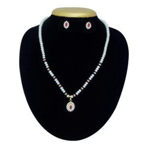White pearls necklace with a shimmery pendant studded with American diamonds & Red crystal
