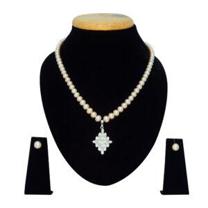 Superbly crafted semi-round pink pearl necklace set with a big diamond-shaped pendant with AD stones