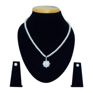 Well crafted white oval pearl necklace set with an AD studded floral pendant