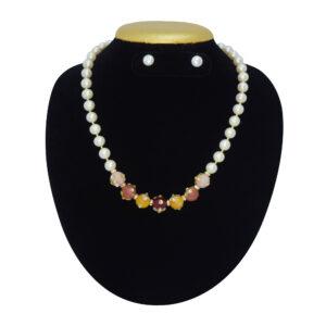 Well crafted round white pearl necklace with multicolour stone beads adorned with kundan stones