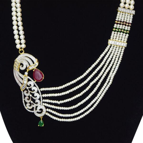 Remarkably well crafted multi-layer white pearl necklace set with a majestic zircon studded pendant on the side - close up