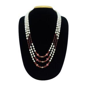 Well crafted triple row white oval pearls mala with beautifully cut red stones & Kundan embellished beads