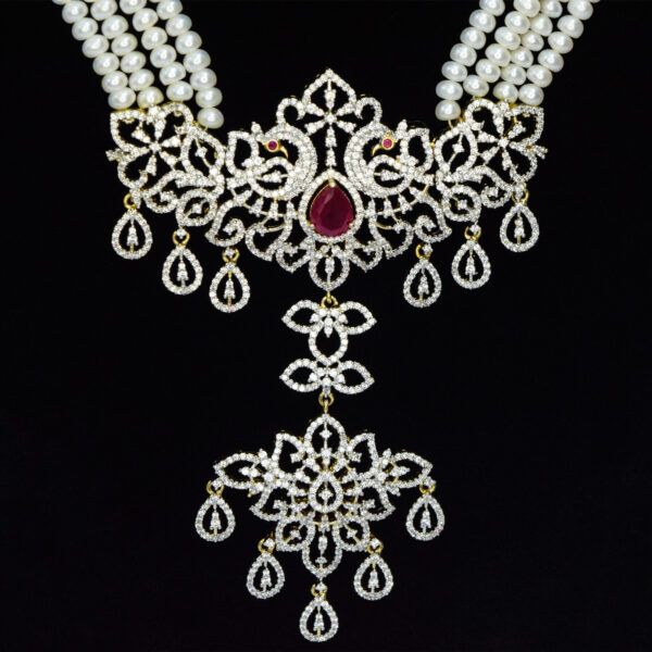 Multi-layer 5mm white semi-round pearl necklace with a majestic zircon studded peacock pendant featuring an SP ruby - close up