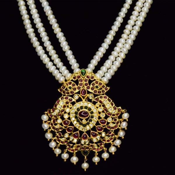 Splendidly crafted triple line white semi-round pearl haar with a grand peacock kemp pendant - pendant