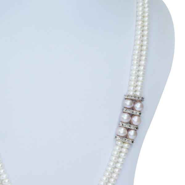 Elegantly crafted dual-layer white semi-round pearls and pink pearls & AD spacers as side brooches - close up