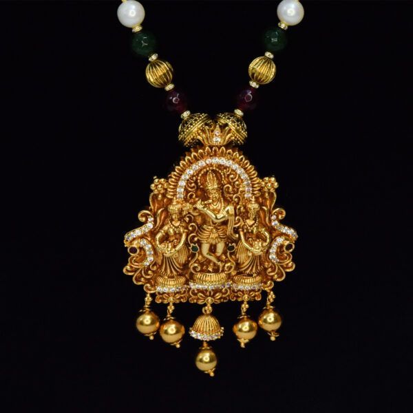Radiant 7mm round white pearls long necklace with a divine golden finish pendant featuring Lord Krishna with his Gopikas beside -close up