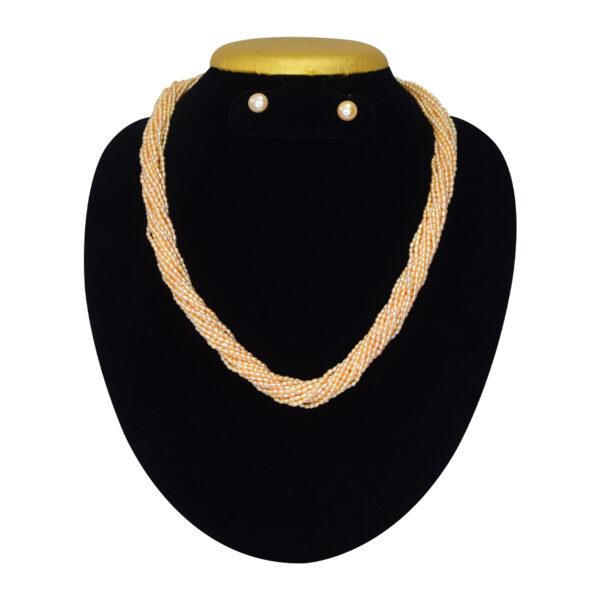 Stunning 15 strands of peach rice pearls finely crafted to a long 20-inch necklace - twisted