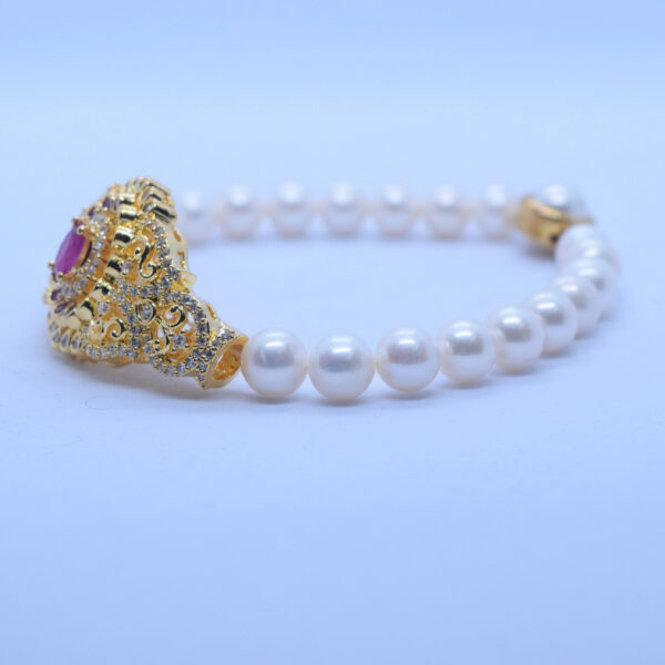 Ornate White Pearls Kada With Grand SP Ruby Clasp - side