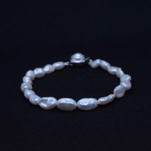 Superb white baroque pearls are well crafted in a single row with a silver finish clasp