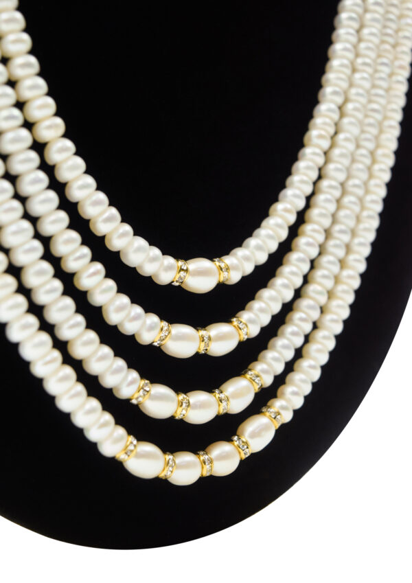 Scintillating Multi-layer Pearls Haar With Grand CZ Side Pendants-close up
