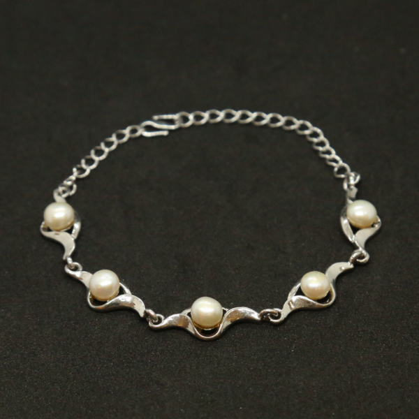 Slender White Button Pearls Bracelet In Silver Finish