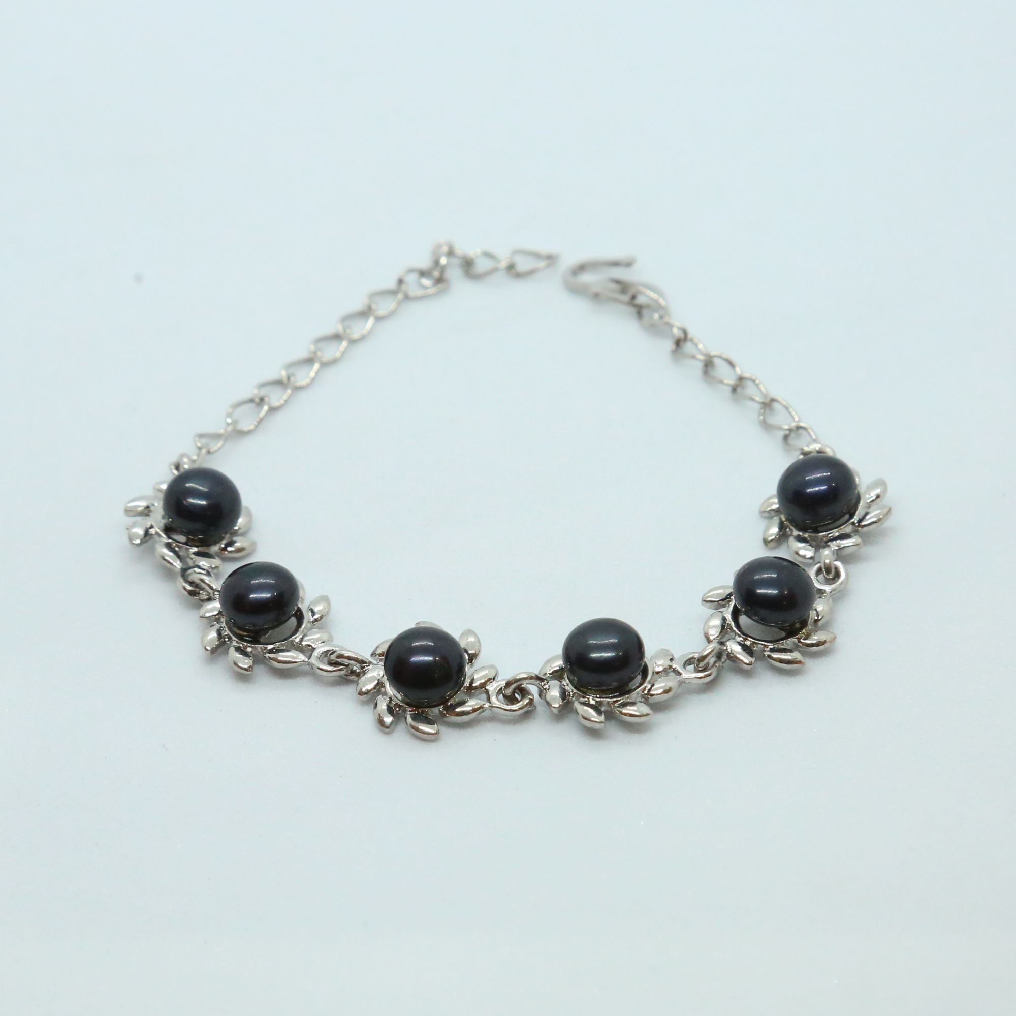 Floral Blue Button Pearls Bracelet In Silver Finish