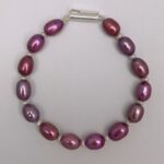 Ravishing Magenta Oval Pearls Bracelet With White Seed Pearls-top