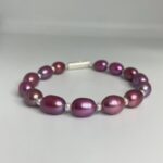 Ravishing Magenta Oval Pearls Bracelet With White Seed Pearls