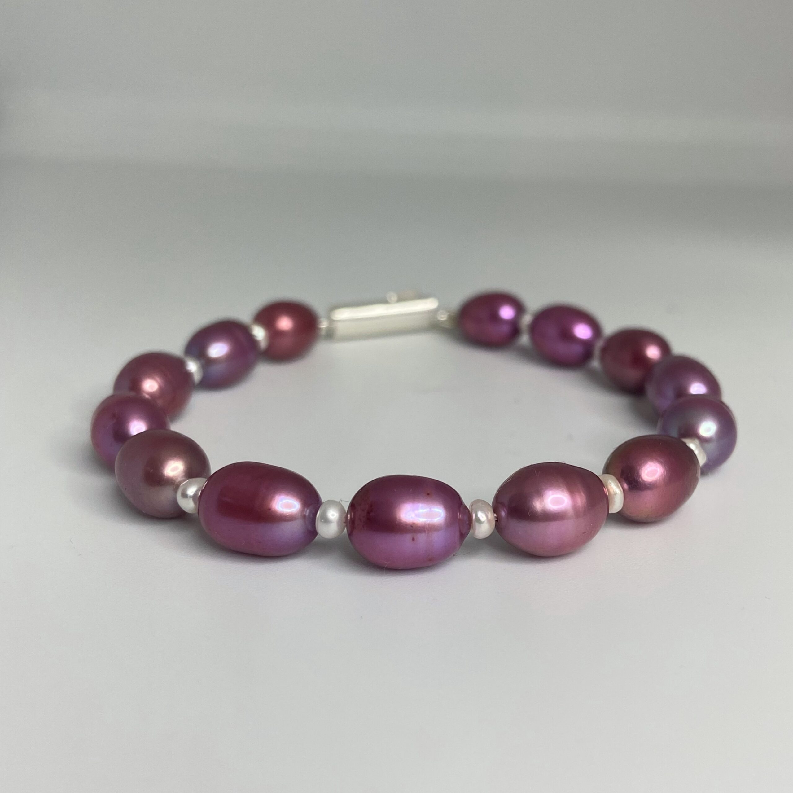 Ravishing Magenta Oval Pearls Bracelet With White Seed Pearls