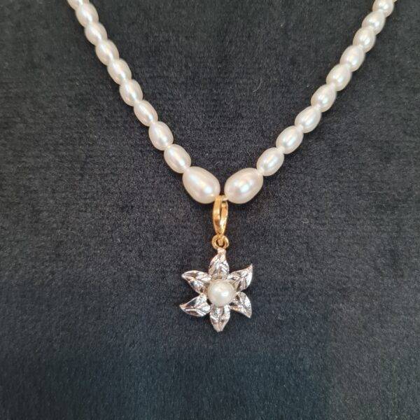 Pretty White Oval Pearl 15Inch Necklace With A Cute Floral Rhodium Finish Pendant-1