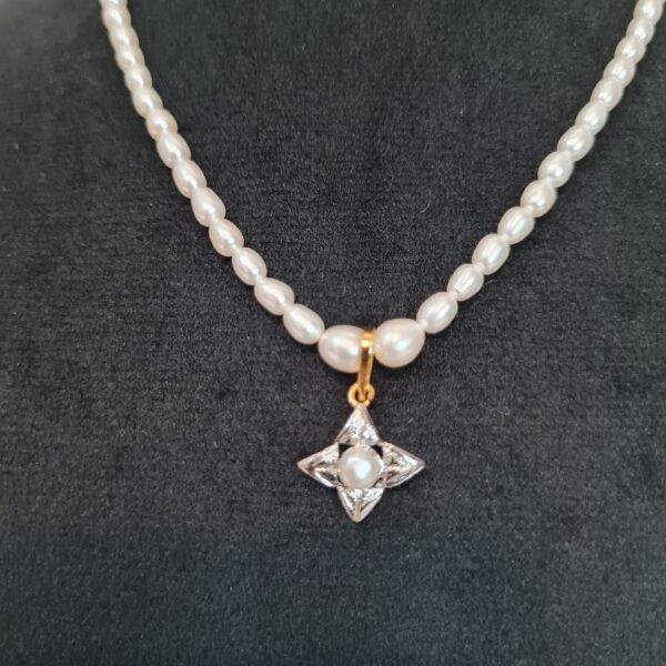 Dainty White Oval Pearl 15Inch Necklace With A Starry Rhodium Finish Pendant-1