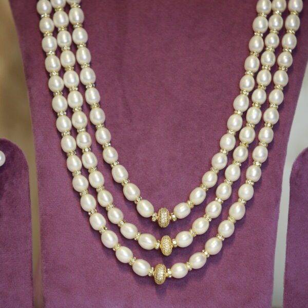 Classy Triple Line 10mm White Oval Pearls Mala With Zircon Spacers-1