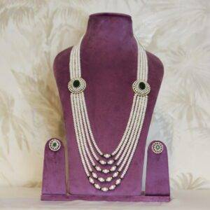 Regal White Semi Round Pearls Haar With CZ & SP Emerald Side Pendants