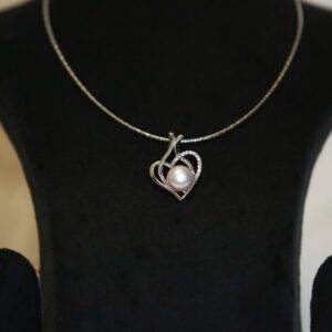 Lovely CZ Heart Pendant Accentuated With Peach Button Pearl